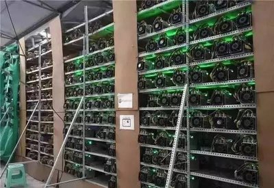 ASIC mining machines at a hosted mining farm undergoing firmware upgrades