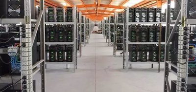 Modern mining farm with rows of efficient mining machines humming with activity