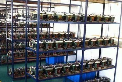 A row of ASIC miners humming away in a professional hosting facility